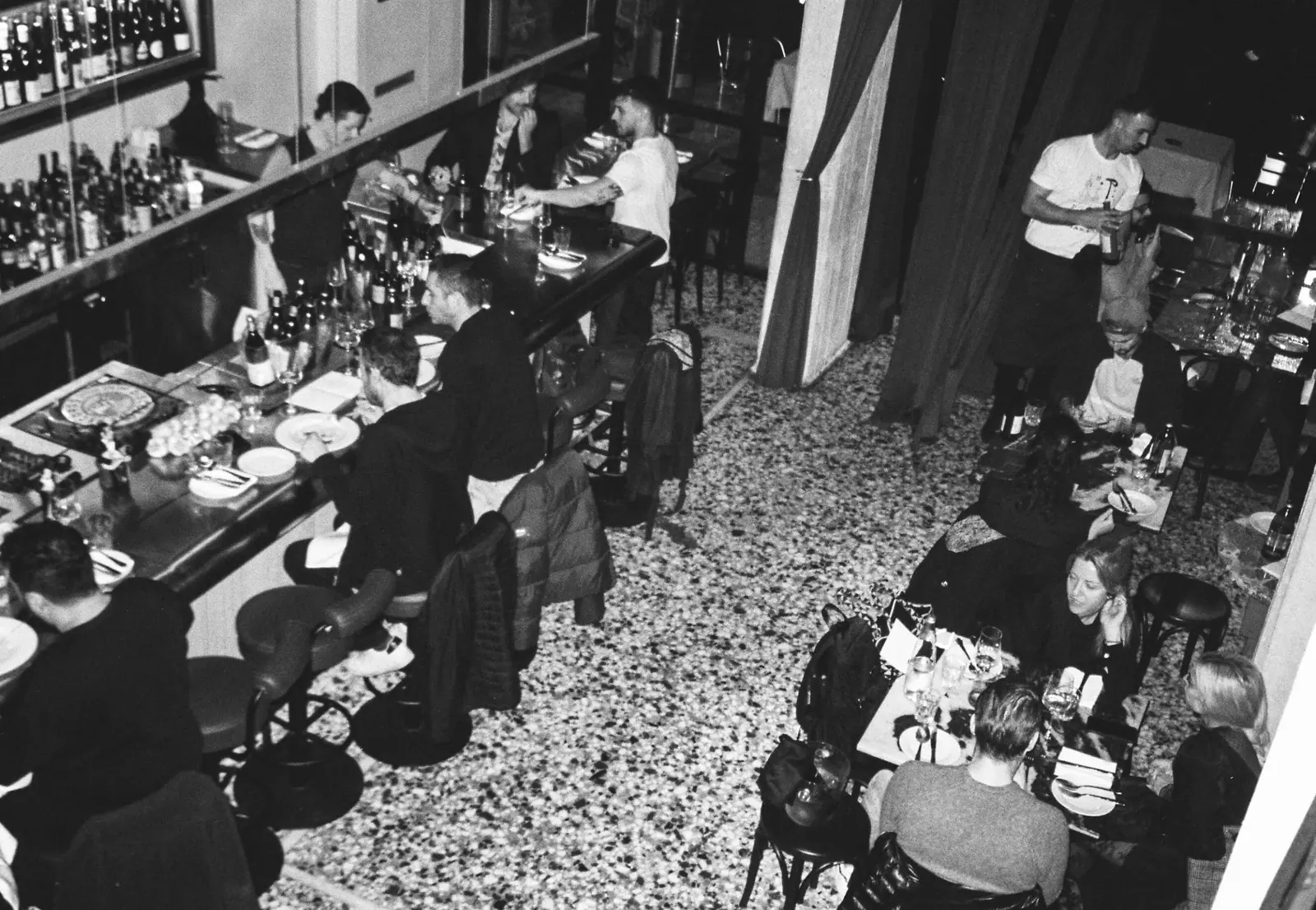 Guests at the counter of Pharaoh, black and white